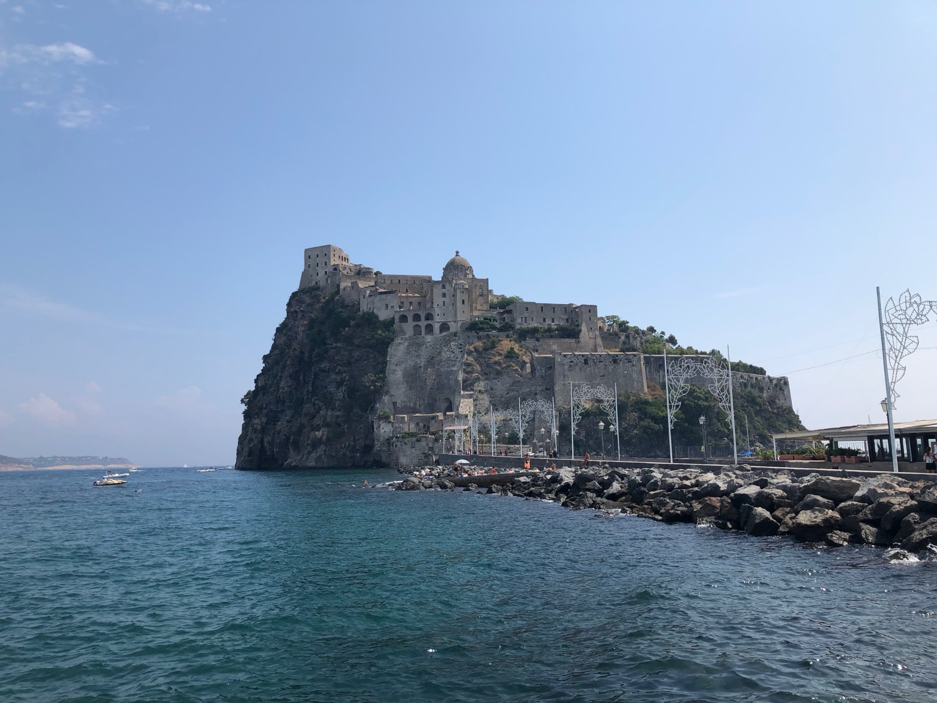 Castello Aragonese rising from the sea