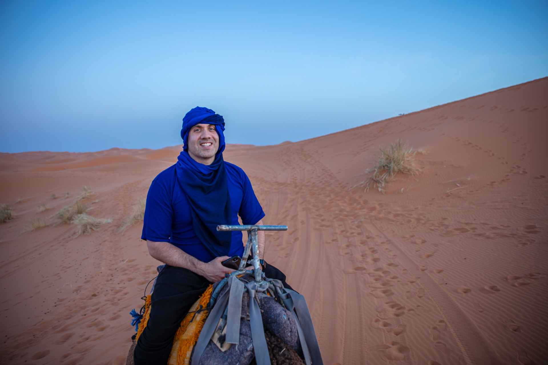Riding through the desert in Berber blue